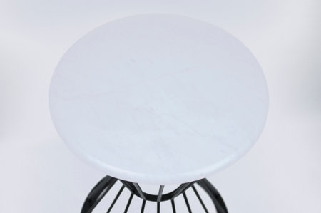 Round serving tray made of marble on a white background. The view from the top. ball isolated on...