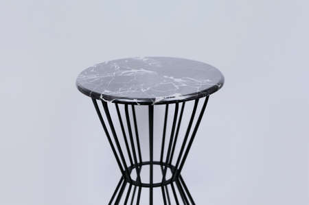 Round serving tray made of marble on a white background. The view from the top. ball isolated on...