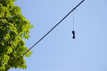 Retro phone handset near chestnut tree