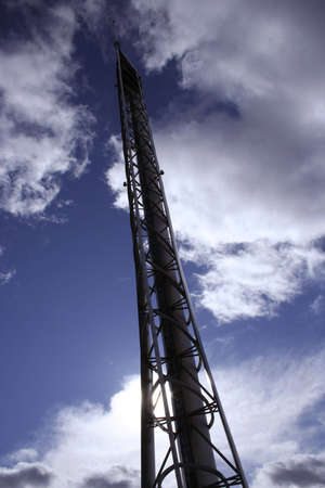 The winglike framework of the Glasgow Tower reaches up into a cloud-sculpted sky