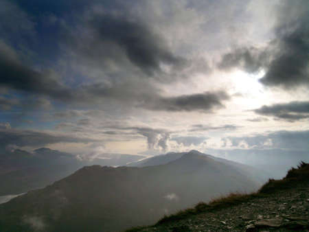 A Scottish hill, The Brack, seen from the top of The Cobbler, and even taller hill, with Loch Long meandering into the distance.の写真素材