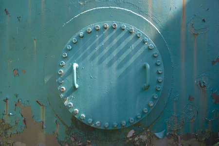 Bolted-on access hatch to an industrial tankの写真素材