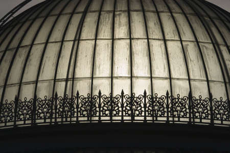 Sunlight passing through a glasshouse dome dripping in condensationの写真素材