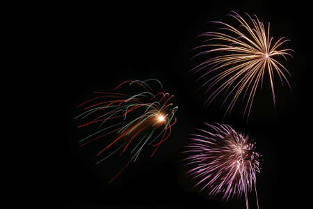 Long exposure of three fireworks going offの写真素材