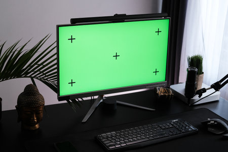 Green monitor screen in a interior. Workspace for podcasting and video blogging.の写真素材