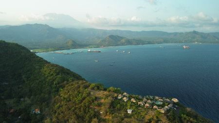 A picturesque birds eye view of the hill. Sunset time by the ocean Bali holidayの写真素材