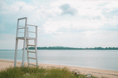 Lifeguard post on the beach against the backdrop of the ocean. An empty booth where lifeguards are supposed to work and monitor the safety of tourists. Vacation on a tropical island.の写真素材