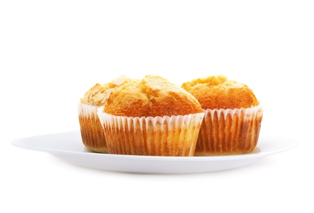 Three muffins in a plate, isolated on white
