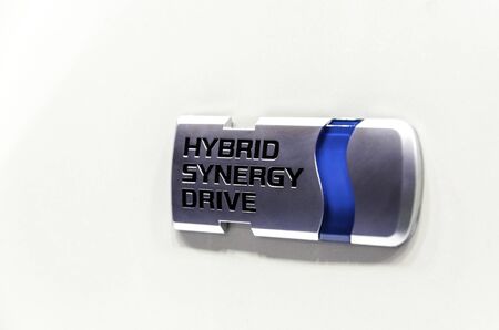 Belgrade, Serbia - 13. March, 2010: Close up of Hybrid Synergy Drive Toyota Logo on a pearl white...