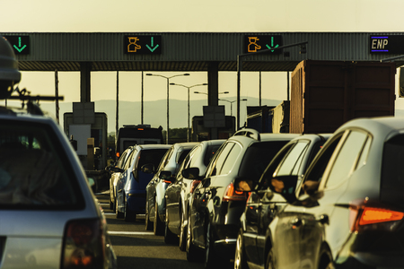 Cars and trucks waiting at point of toll highway - Toll station check point traffic jam - Highway...