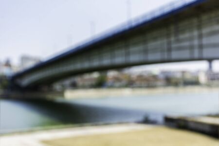 Blurred image of modern city bridge over the river of danube in belgrade serbiaの写真素材