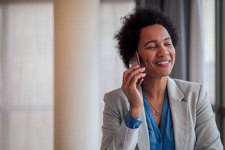 Close-up of businesswoman with eyes closed talking on smart phone, Happy female manager is wearing...