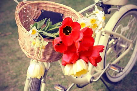 Retro photo  Bike with flowers in a basketの写真素材