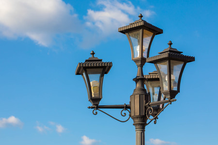 Copy space of street light lamp with blue sky and white clouds background. Transportation and travel conceptの写真素材