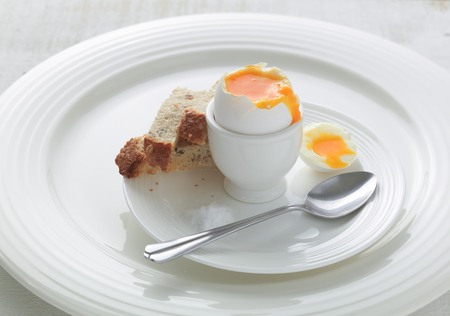 Soft boiled egg with toasted bread soldiersの写真素材