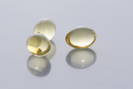 Heap of fish oil Omega 3 capsules isolated on a white background