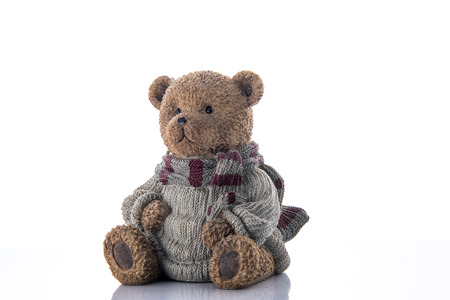 Brown bear money-box isolated on a white backgroundの写真素材