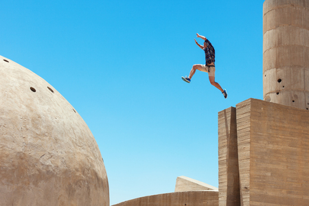 risky man jumping, in little motion blurの写真素材