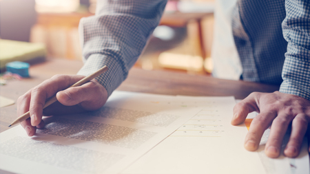 Paperwork on the table. New business plan analyse. Man working in open space. Film effect, lens flare effectの写真素材