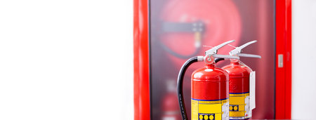The red fire extinguisher is ready for use in case of an indoor fire emergency.