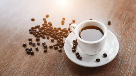 Coffee cup and saucer on a wooden table. Dark background.の写真素材