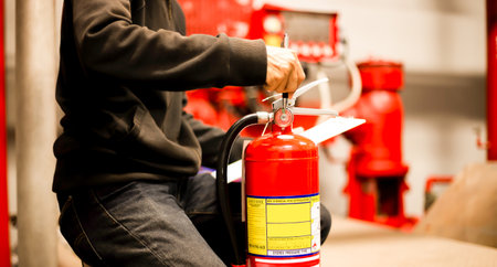 Engineer checking Industrial fire control system,Fire Alarm controller, Fire notifier, Anti fire.System ready In the event of a fire.の写真素材