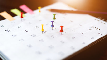 Calendar and scheduled appointments with pins.の写真素材