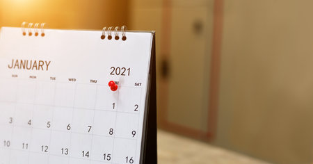 Close up the calendar on the brown table in planning ideas.の写真素材