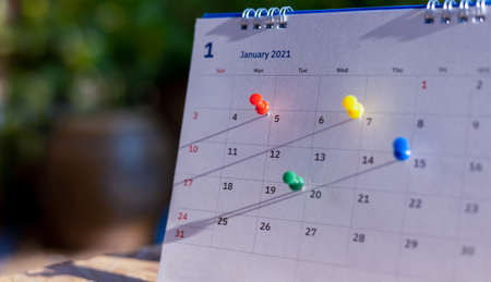 Calendar and scheduled appointments with pins.の写真素材