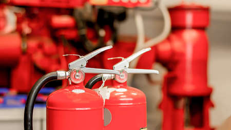 the red fire extinguishers are ready for use in the event of a fire inside the building.の写真素材