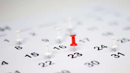 The pin on the calendar indicates the schedule, planning concept.の写真素材