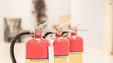 The red fire extinguisher is ready for use in case of an indoor fire emergency.