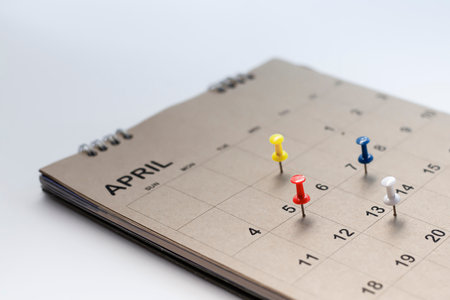 Calendar and scheduled appointments with pins.の写真素材