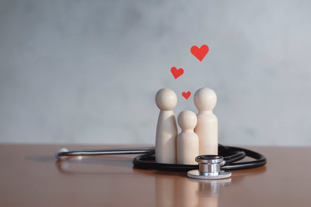 Family with stethoscope and red heart The concept of physical examination and family health insurance.の写真素材