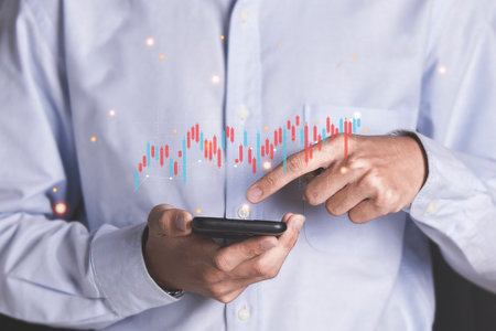 Businessman showing virtual hologram stock on smartphone Marketing and Strategy Stock Market Business Growth progress or success investmentの写真素材