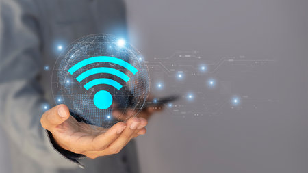 Businessman holding a wireless internet connection in his hand. Internet technology concept.