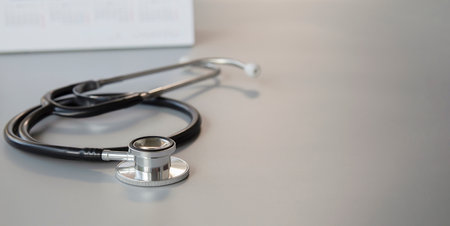 Stethoscope on the table, closeup. Medical concept.