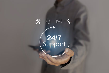Businessman holds virtual 24/7 with clock in hand for non-stop and full-time global contacts....