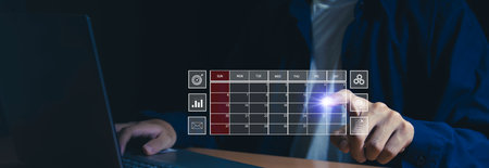 Businessman uses index finger to set agenda on calendar as appointment planning concept.