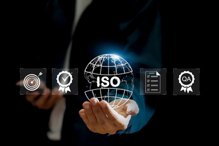 Businessman ISO symbol showing quality assurance on virtual screenの写真素材