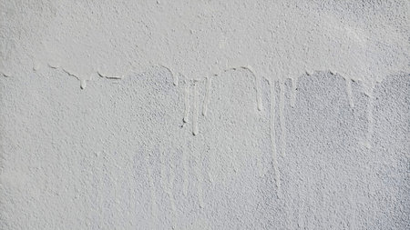 Cement wall with white drippingsの写真素材