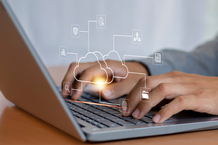 Cloud computing technology concept. Businessman working on laptop computer with cloud computing...