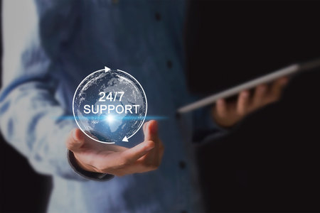 View of a Businessman holding earth globe with 24/7 support text