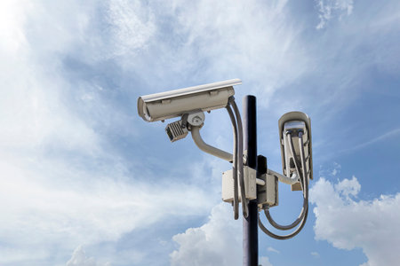 Install CCTV cameras outside the building, sky and cloud backgroundの写真素材