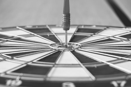 The dart hits the center of the business success goal concept.
