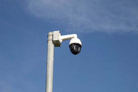Security camera on blue sky background,