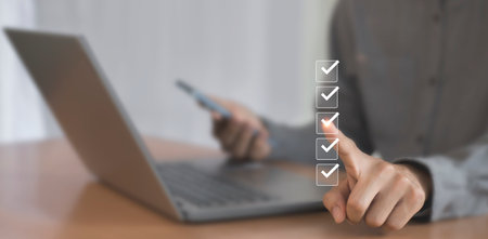 Checklist concept. Businessman is marking checkboxes.
