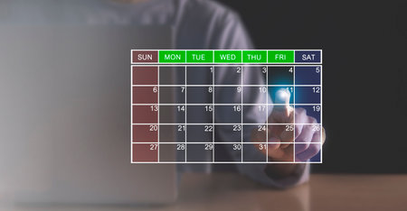 Businessman hand touching calendar on virtual screen. Business planning concept.の写真素材