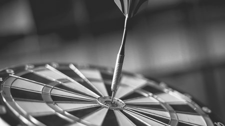 Close up of dart arrow hitting center of dartboard, business success conceptの写真素材