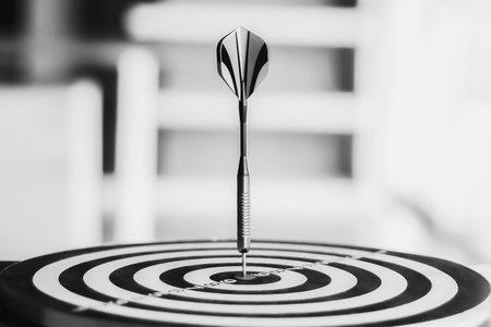 Darts arrows hitting the center of dartboard, business success conceptの写真素材